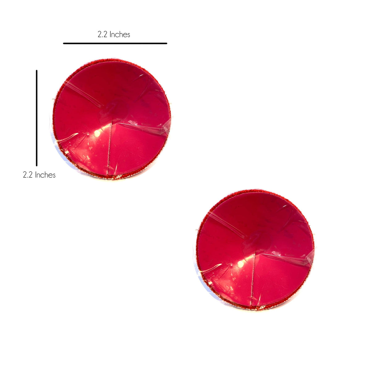 Red and green jingle bell reusable silicone pasties shown on a clean background