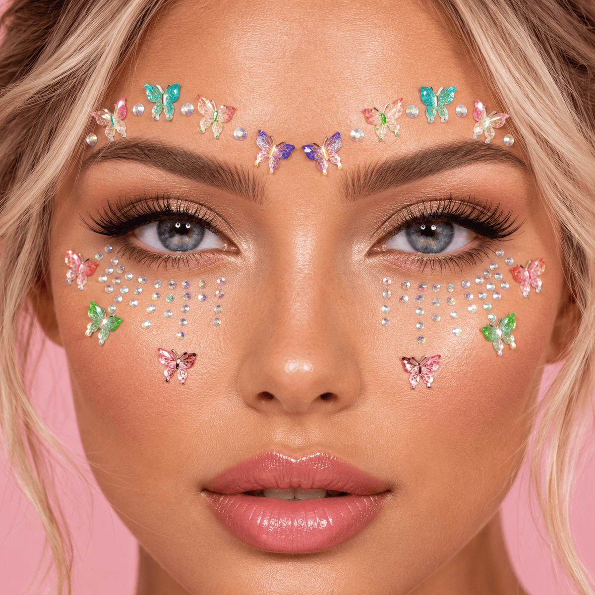 Iridescent butterfly crystal face jewels styled as a cute costume look on the face