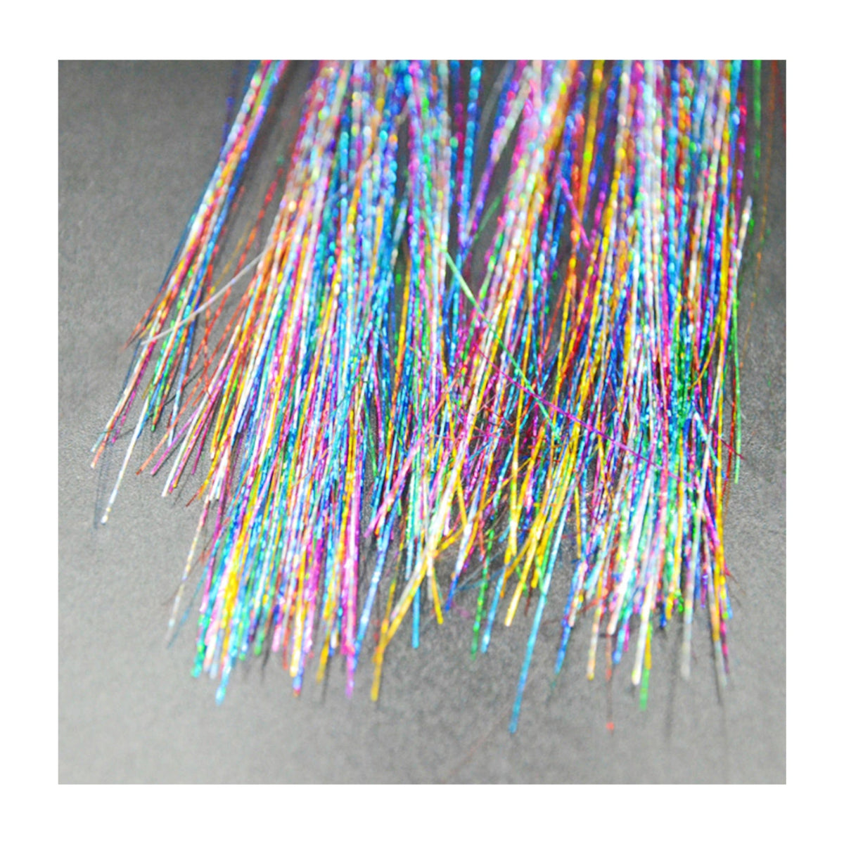 Rainbow sparkle tinsel clip in hair extensions in full view with its signature color and shape
