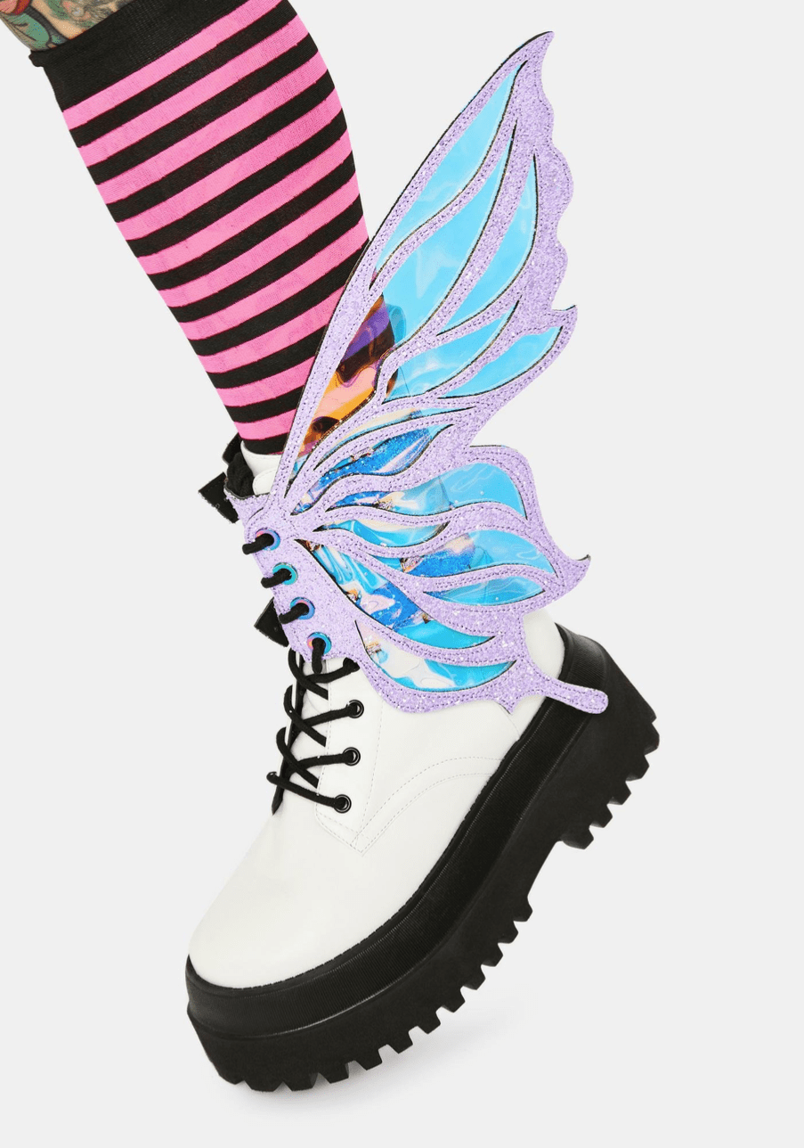 Model showing off the lilac glitter fairy boot wings, pastel pixie look