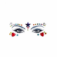Colorful rhinestone stars and hearts arranged as face gems for cosmic rave makeup
