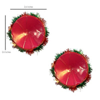 Front view of red and green pom pom bell reusable silicone pasties with the full design visible