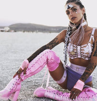 Iridescent and black crystal tiara face jewels for a bold warrior makeup look
