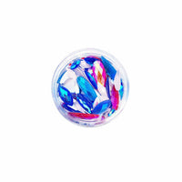 Product shot of teal iridescent crystal face stickers with orange iridescent accents