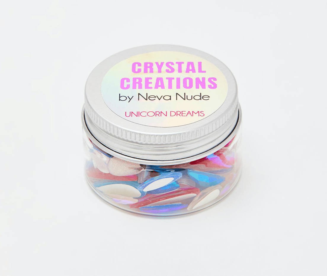 Teal iridescent crystal face stickers shown alone, in shimmering blue and white crystals