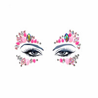 Sparkling pink and white face crystals arranged for glowing blacklight makeup