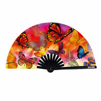 View of the orange sunset butterfly blacklight folding fan showing the overall design and color