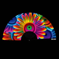 Neon daisy blacklight folding fan with a colorful flower power print for festivals