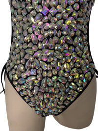 Black bodysuit with dazzling crystal embellishments across a sheer mesh base