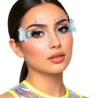 3D butterfly face jewels surrounded by tiny crystal dots for festival makeup
