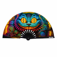 Blacklight folding fan featuring a neon cat with a toothy grin for festival fun