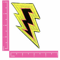 Neon yellow lightning bolt nipple pasties that pop under blacklight