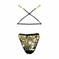 Close up of the back of a gold mirror bodysuit showing reflective tiles