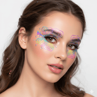 Iridescent butterfly wing face art sticker with jewel accents and a holographic glow
