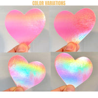 Pink holographic shimmer heart nipple pasties with a glossy rainbow sheen