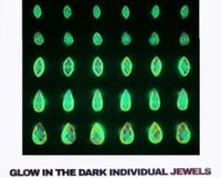 Iridescent teardrop and round face gems that glow softly in the dark at festivals