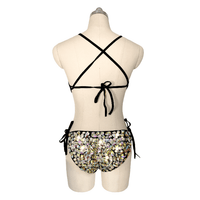 Black mesh bodysuit studded with shimmering iridescent crystal jewels