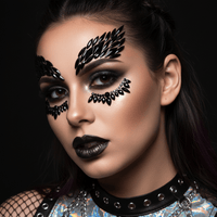 Black crystal face gems in a winged design for a bold huntress makeup look