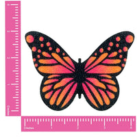 Front view of pink and orange ombre velvet glitter butterfly pasties with the full design visible