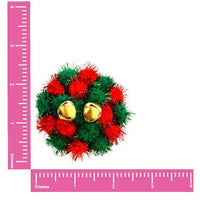 Red and green pom pom bell reusable silicone pasties laid out to show color and finish