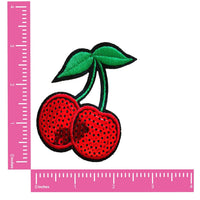 Red and green sequin cherry shaped nipple pasties, shown on their own