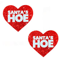 Red glitter blacklight heart nipple pasties with a naughty Santa Christmas design