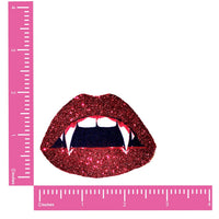 Pair of red glitter vampire bite nipple pasties with fangs for a spooky Halloween costume