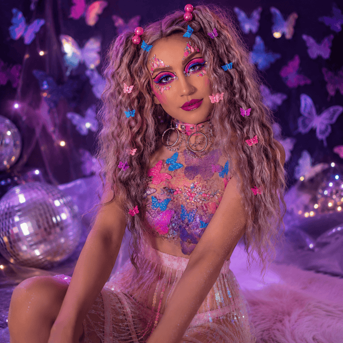 Pastel butterfly glitter and neon pigment bundle laid out for a festival look