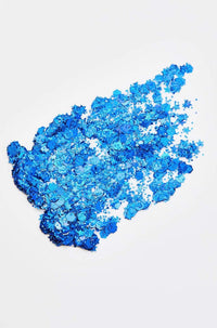 Close up detail of the colors on cosmetic glitter keychains in aloe gel