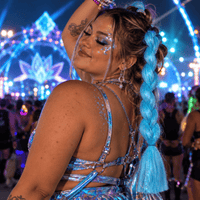 Light blue iridescent tinsel jumbo hair braid in a neon lotus festival portrait
