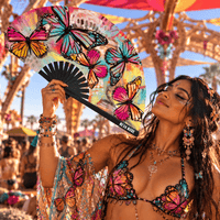 Multicolor butterfly blacklight reactive folding fan shown up close to highlight the finish