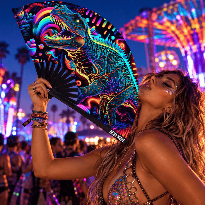 Neon dinosaur blacklight folding fan held open in a colorful festival portrait