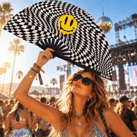 Yellow checkered melty face folding fan posed at a festival in golden hour light