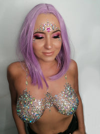 Studio view of icy crystal pasties and lunar face sticker bundle with true to life color