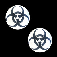 Product shot of black glitter biohazard nipple pasties with a reflective grey hazard symbol