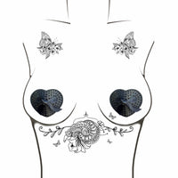 Black crystal heart reusable silicone pasties laid out to show color and finish