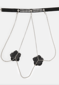 Product view of the black flower silver stud silicone nipple pasties highlighting shape and color