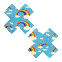 Blue glitter rainbow and cloud X nipple pasties shown on a clean background