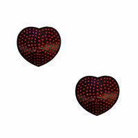 Red crystal on black heart reusable silicone pasties shown on a clean background