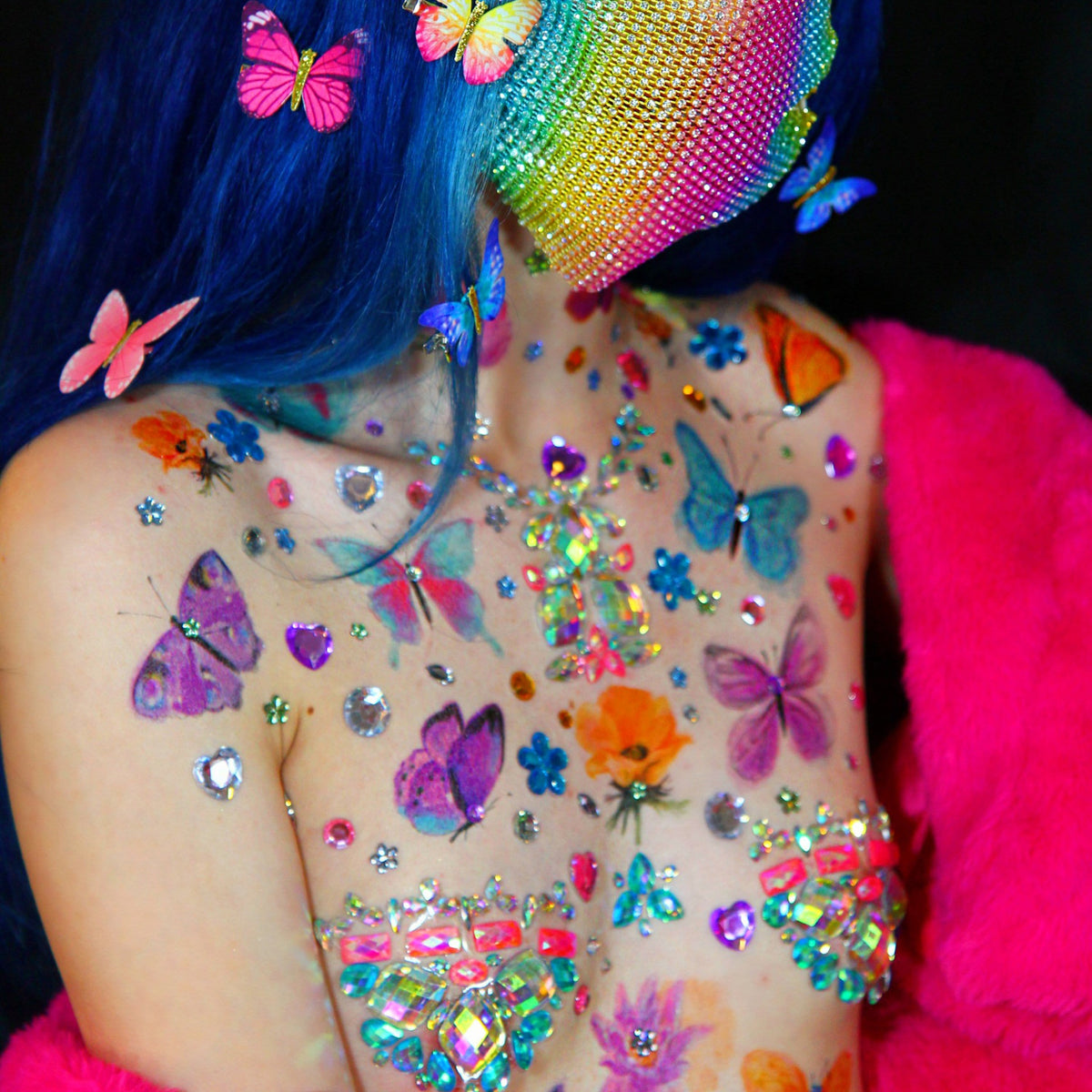 Model wearing blue butterfly large temporary tattoos on her body