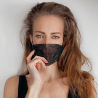 Model rocking the black iridescent crystal mesh jewel mask with adjustable loops