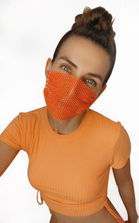 Model wearing the neon orange blacklight crystal mesh face mask at a UV rave