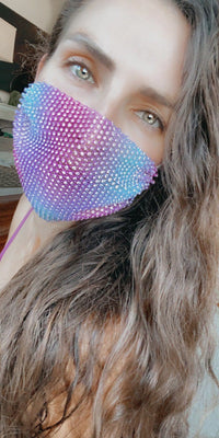 Model wearing the pastel pink purple blue crystal mesh face mask at a festival