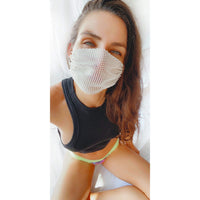 Model wearing the white iridescent crystal mesh jewel face mask for a diamond glam look