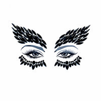 Black crystal winged face jewels with a dramatic sweep for dark eye makeup, shown alone