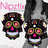 Pair of UV reactive sugar skull nipple covers for Halloween parties, shown on their own