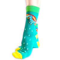Pair of rainbow dinosaur cotton novelty socks with a playful pride vibe