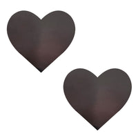 Standalone product shot of the black neon green heat reactive heart nipple pasties