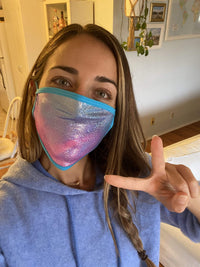 Front view of pink and blue holographic face mask with matching pasties with the full design visible