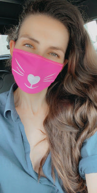 Front view of neon pink face mask with white glitter kitty whiskers with the full design visible